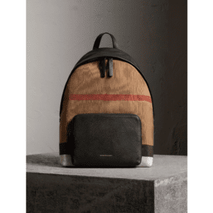 A brown check canvas backpack with black panel