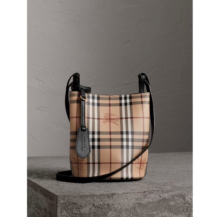 A burberry bag is shown on display.