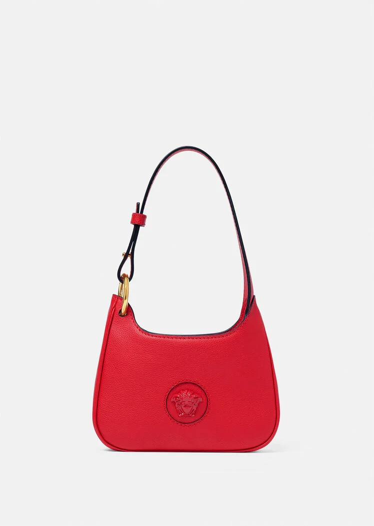 A red purse with a gold logo on it.