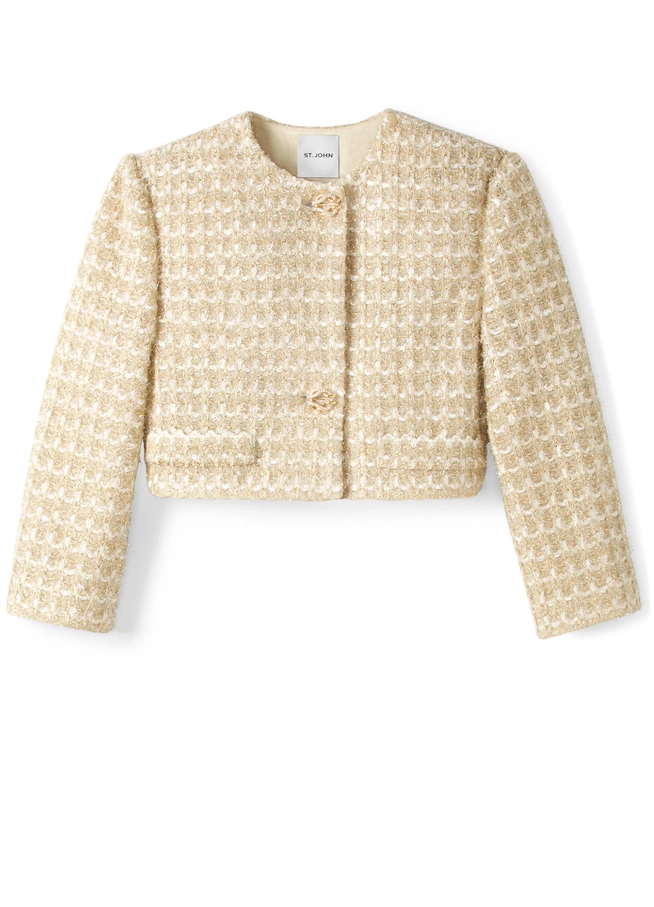 A small cream colored metallic jacket for women
