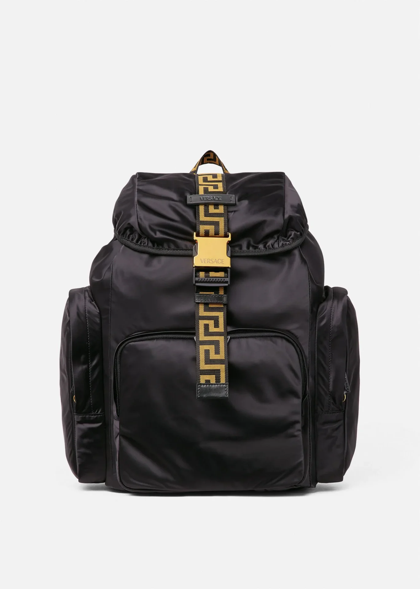 A black backpack with gold accents on it.