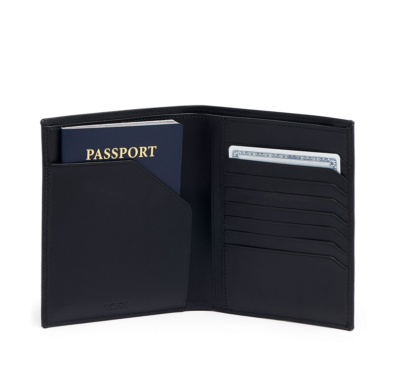 A black tumi nassau passport case with a passport