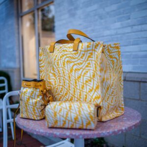 A set of fendi mimosa bags in yellow and white