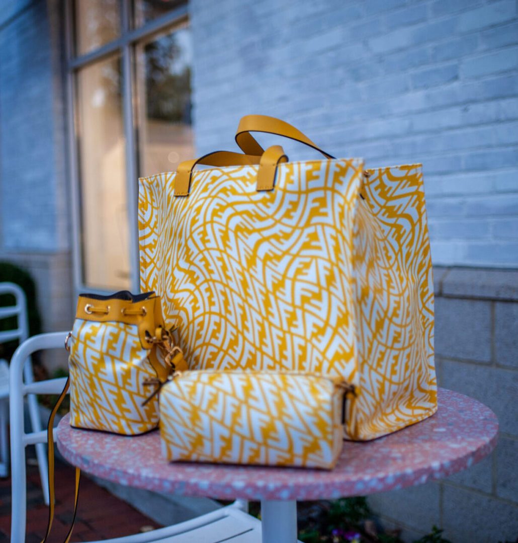 A set of fendi mimosa bags in yellow and white