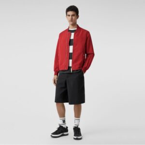 A person wearing a burberry red jacket