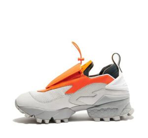 A pair of orange, grey, and white sneakers