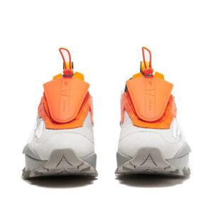 The front view of an orange and white sneakers