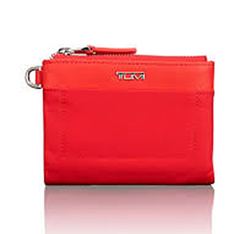 A red tumi voyageur double zip wallet