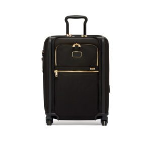 A black carry on bag with wheels and gold zipper