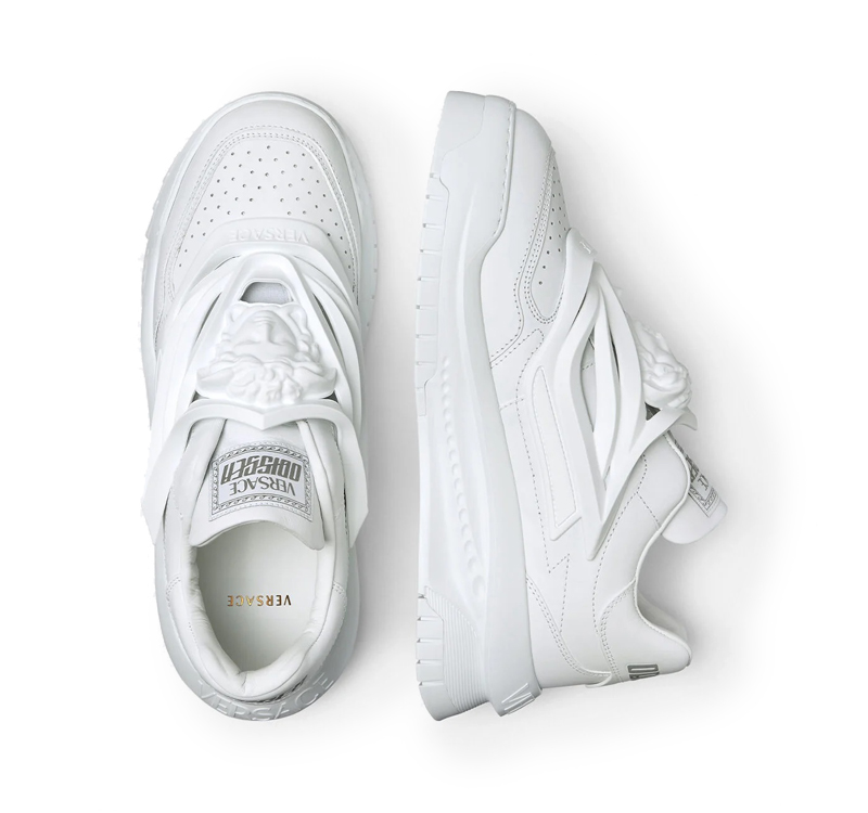 A pair of white versace odissea sneakers