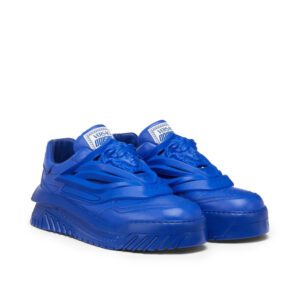 A pair of bright blue sneakers with medusa faces