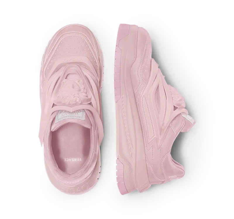 A pair of baby pink versace odissea sneakers